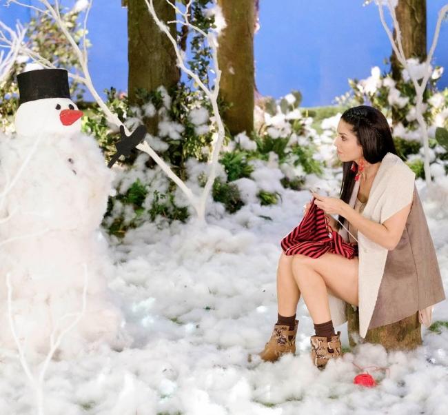 Sunny Leone shares cute image of herself knitting scarf for snowman 