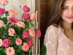 With a bouquet of rose by her side, Nusrat Jahan looks gorgeous in her latest Instagram photo
