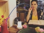 Sunny Leone shows her unique fashion of drinking juice with a long pipe