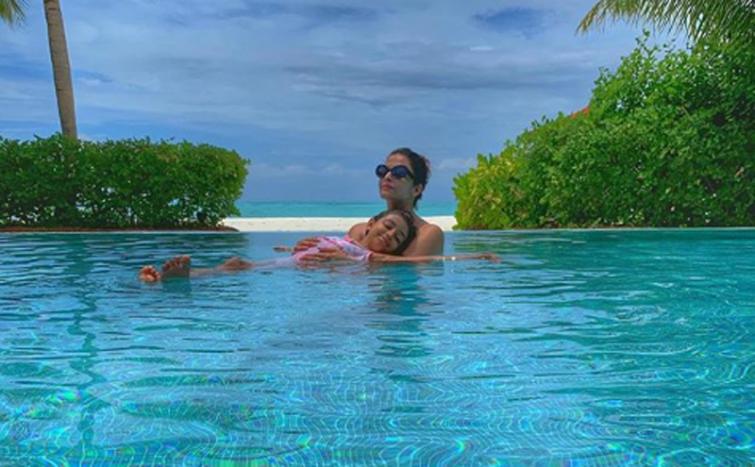 Into the pool: Abhishek Bachchan shares image of his 'girls' on social media
