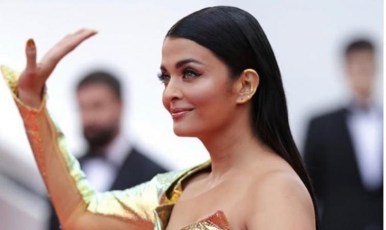 On her first appearance, Ash glams up Cannes red carpet in golden ensemble