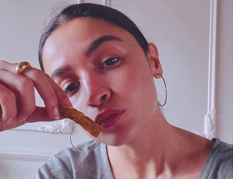Alia Bhatt looks stunning as she poses before the camera with French fries in her hand 