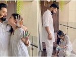 Mouni Roy touches her husband Suraj Nambiar's feet during Holi celebrations
