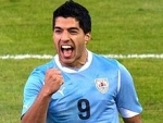 FIFA bans Uruguay's Suarez for four months for biting opponent