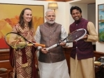 Leander, Hingis present Tennis autographed racquets to PM Modi