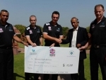 Elite umpires donate US$10,000 to Voluntary Health Services charity