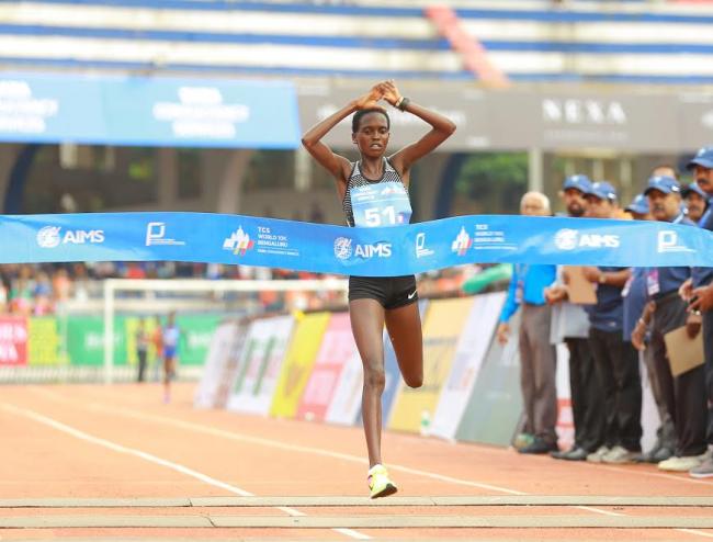 Kenyaâ€™s Irene Cheptai crosses the finish line in 00:31:51 seconds to win her maiden overall womenâ€™s title at the TCS World 10K Bangalore 2017.