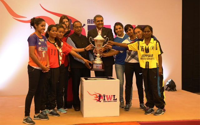Six players along with Mr. Vijay Goel, Mr. Praful Patel, Mrs. Sara Pilot & Sakshi Malik posing with the IWL trophy 