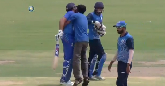 Fan breaches security, kisses Rohit Sharma on the cricket field