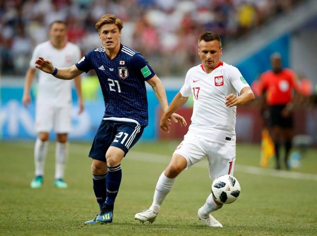 Japan reach World Cup knockout stage despite loss against Poland