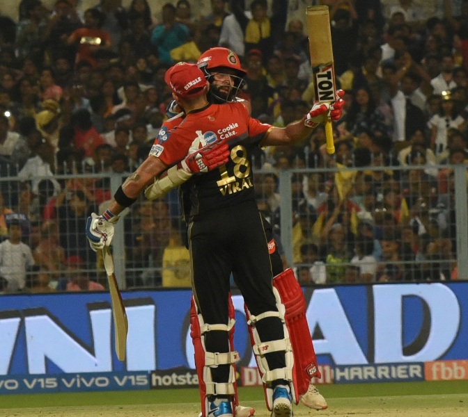 Royal Challengers Bangalore wins by 10 runs despite Russell, Rana scare