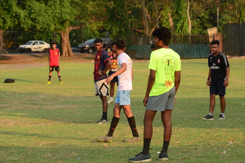Young boys prepare to play a game of football in Kolkata, India. Football (known as Soccer in the U.S.) is a game that almost every kid in India learns to play or is interested in. PC: Avishek Mitra