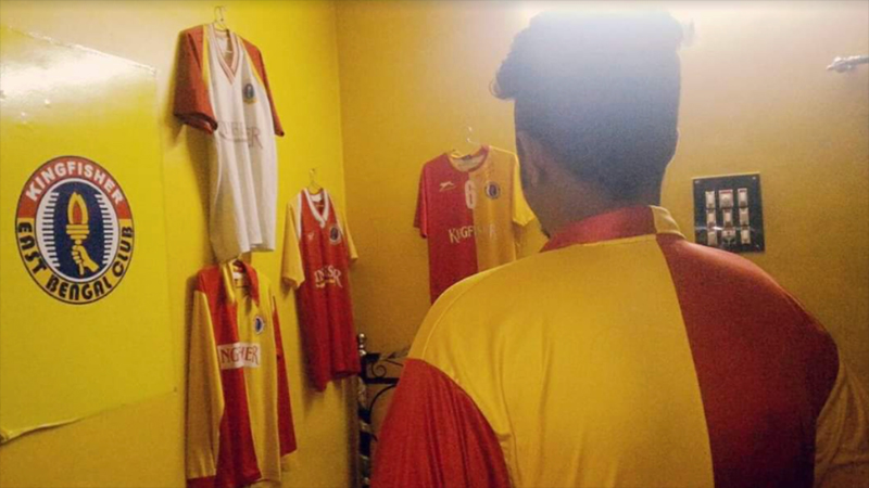 Indian Football fan, Arkadeep Dey shows his room “decked out” in football gear for the East Bengal Football team