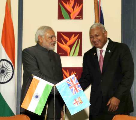 Modi being received on his arrival, at Nausori International Airport