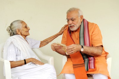 Narendra Modi taking blessing of his mother