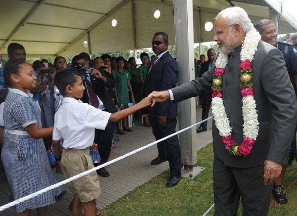 Modi being received on his arrival, at Nausori International Airport