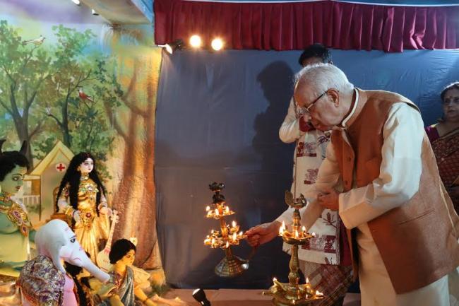  Governor of West Bengal Shri Keshari Nath Tripathi is offering an arati to the Durga idol