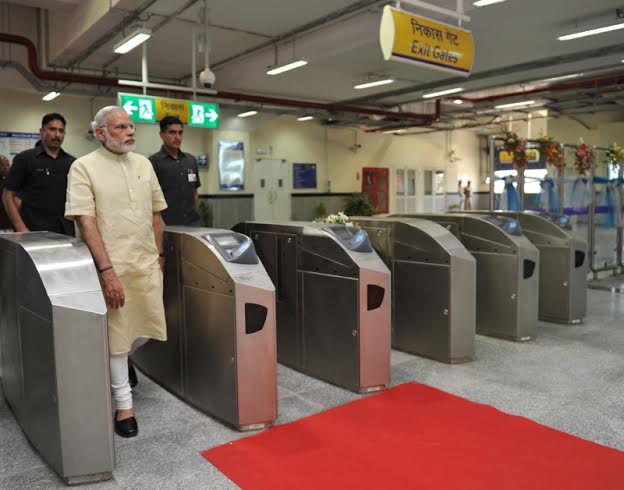 Narendra Modi travelling by the Delhi Metro