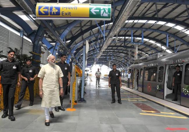 Narendra Modi travelling by the Delhi Metro