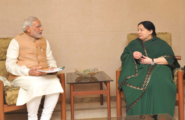 Narendra Modi being received by the Governor of Tamil Nadu