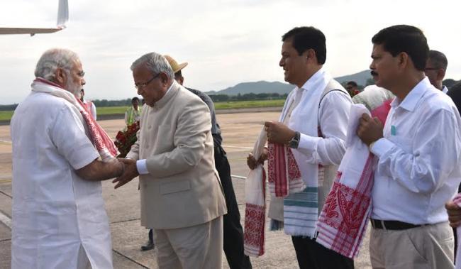 Narendra Modi being received by the Governor of Assam