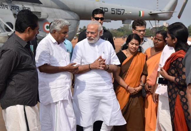Narendra Modi being received by the Governor of Kerala