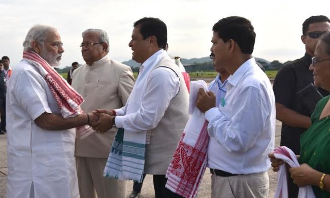 Narendra Modi being received by the Governor of Assam