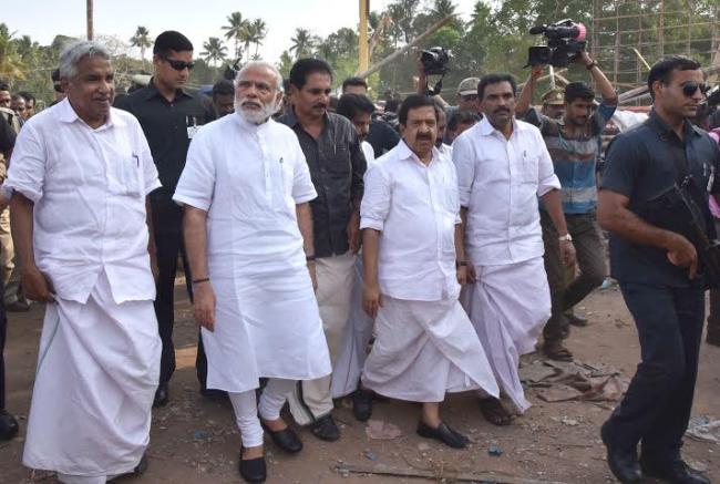 Narendra Modi being received by the Governor of Kerala