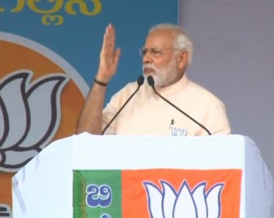 Urge people of Karnataka to remain vigilant and beware of divisive politics of  Congress: Modi