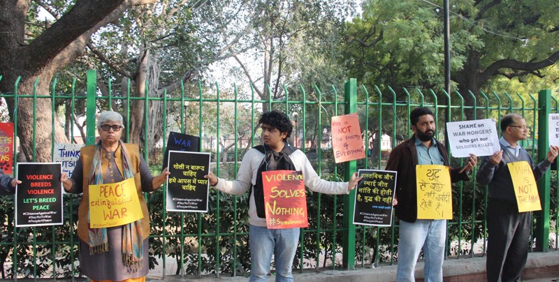 Members of Citizen Against War form human chain for peace
