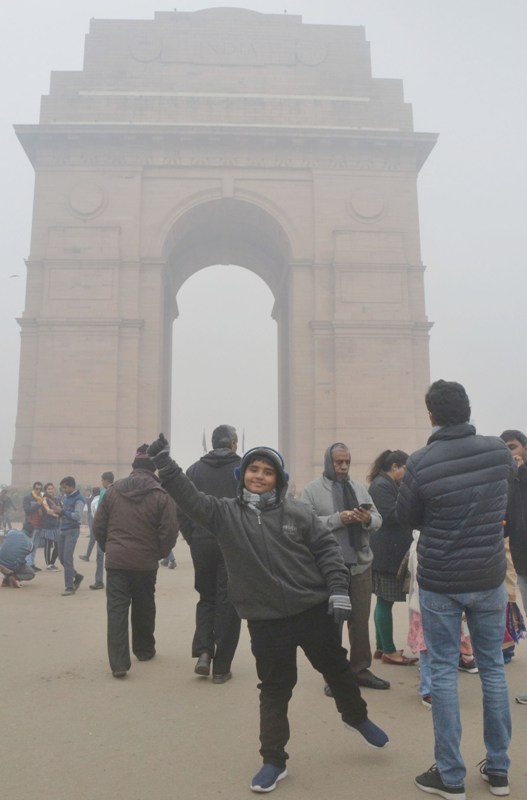 Visitors wrap themselves in warm clothes in New Delhi