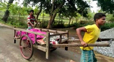 Injured woman carried to hospital in a hand-pulled-cart