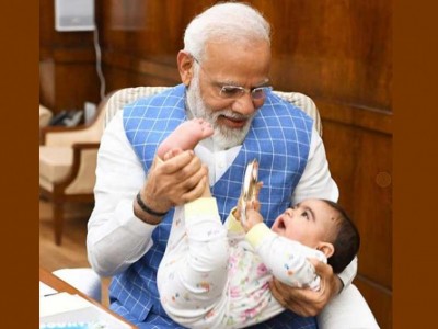Social media users welcome Narendra Modi's Instagram image playing with kid