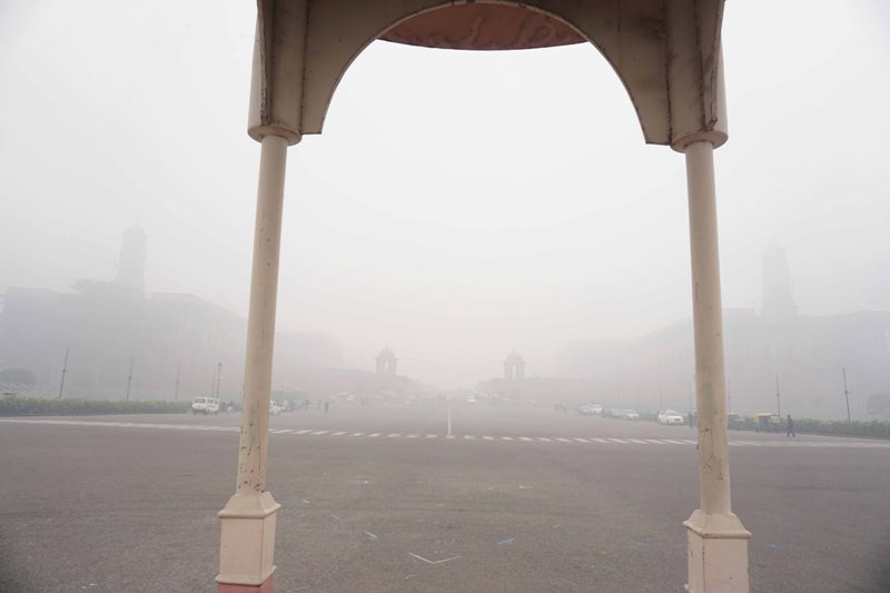 Visitors wrap themselves in warm clothes in New Delhi