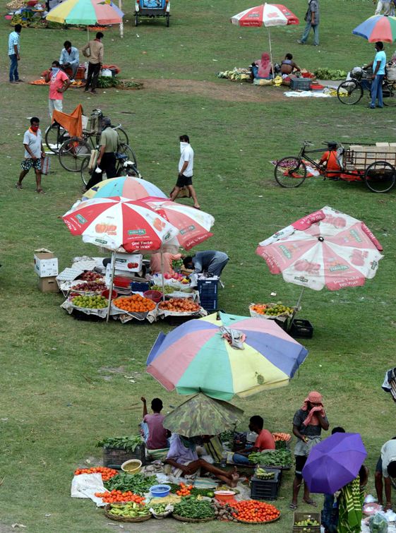 People maintain social distancing at Kolkata market during lockdown