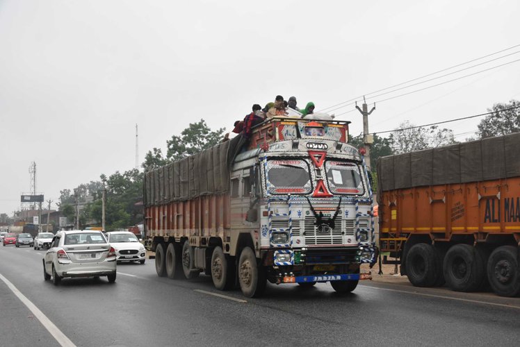 Labourers in safe place during rain and wind before cyclone Amphan