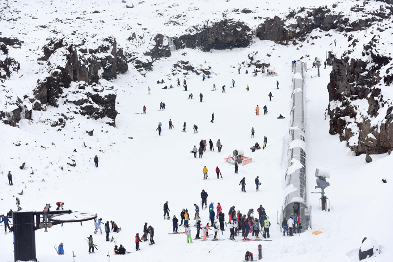 People ski at Whakapapa ski field in New Zealand