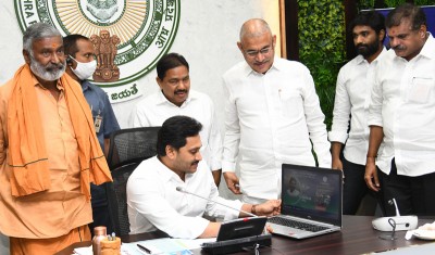 Andhra Pradesh Chief Minister Y S Jagan Monhan Reddy releasing Cheque