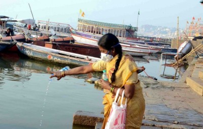 Woman offers obeisance to Ganges in locked down Varanasi