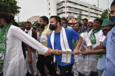 RJD protests against fuel price hike, Tejashwi attacks Modi govt