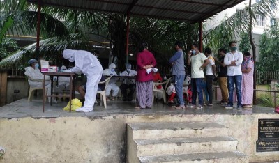 Mumbai: Health workers from MCGM conduct medical checkup of residents in a COVID-19 containment zone