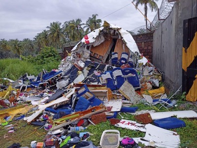 Broken Air India Express Boeing 737 repatriation flight lies amid debris in Kozhikode, Kerala