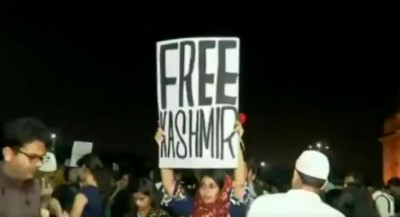 Woman holding 'Free Kashmir' placard apologizes