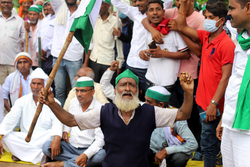 Prayagraj: Bharatiya Kishan Union workers block National Highway to protest against Farm Bills