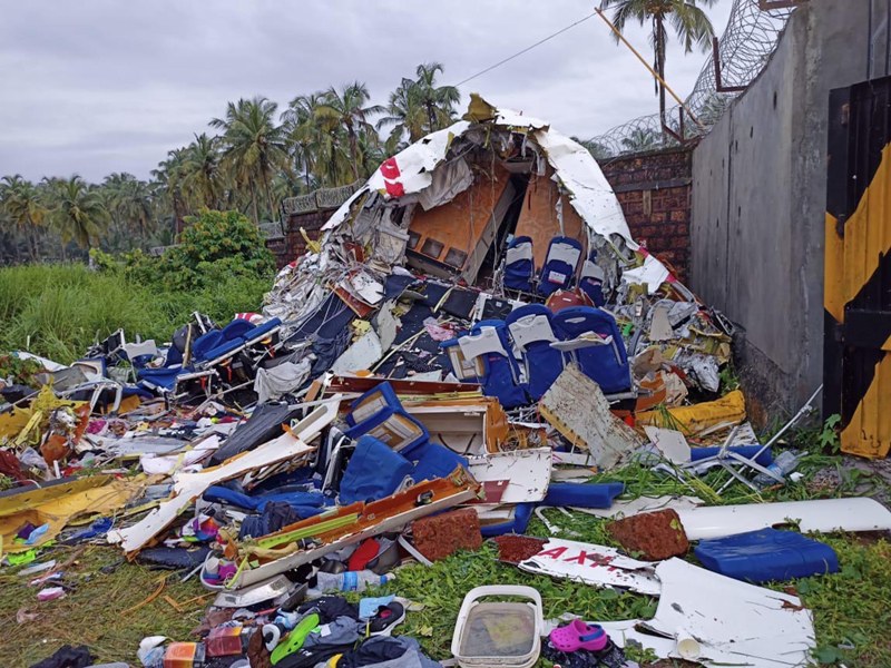 Broken Air India Express Boeing 737 repatriation flight lies amid debris in Kozhikode, Kerala