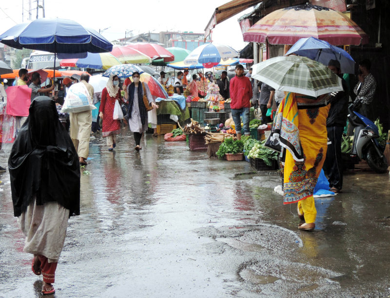 People walking down the Lal Chowk in Srinagar
