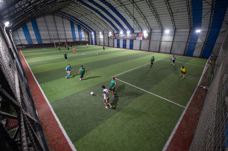 People play soccer at am indoor stadium in Istanbul