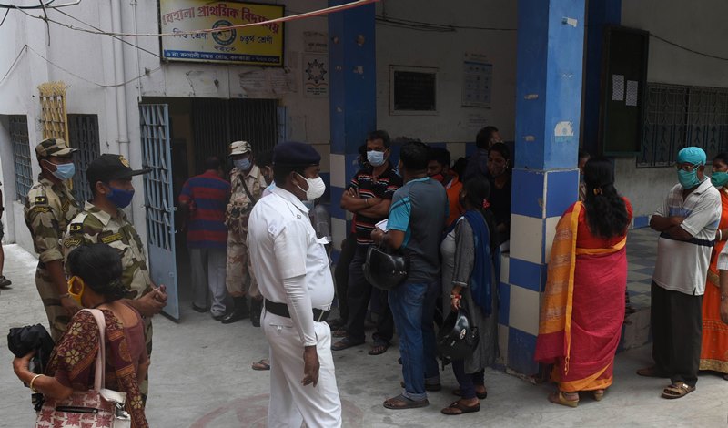 Voters waiting in queue at Thakurpukur polling station in Kolkata during Bengal Assembly Elections