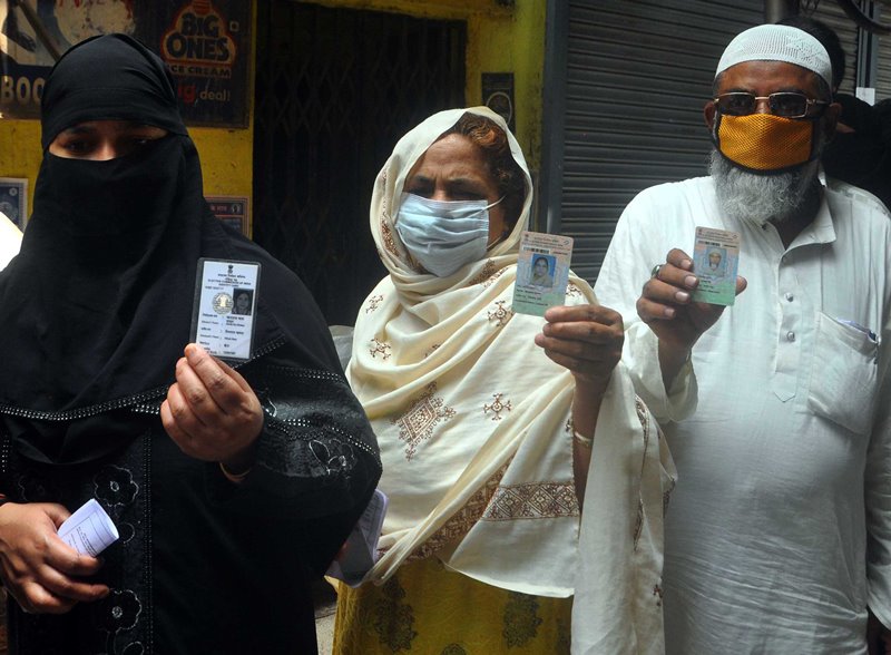 Voters waiting in queue at Thakurpukur polling station in Kolkata during Bengal Assembly Elections