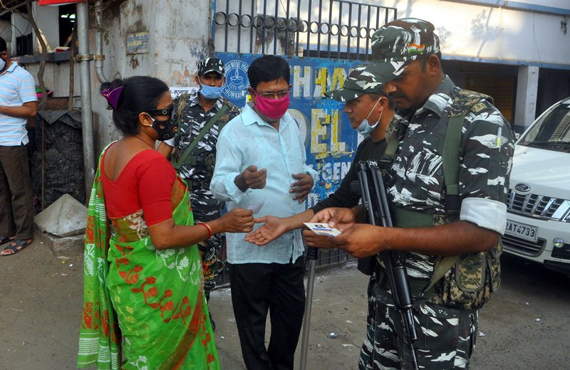 Voters waiting in queue at Thakurpukur polling station in Kolkata during Bengal Assembly Elections